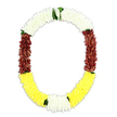 A richly detailed ceremonial garland in an open oval, or U-shape, is set against a clean white background, giving the impression that it floats in still air. The top arch is composed of densely strung white blossoms, tiny, petal-packed clusters that recall jasmine or miniature chrysanthemums, offering a soft, cushiony texture and a feeling of quiet purity. As the garland flows down each side, the palette deepens into broad bands of maroon and reddish-brown petals, carefully layered so that the surface looks plush and velvety, bringing a sense of solemnity and grounded strength. At the bottom curve, the colours turn to a band of bright, uplifting yellow, the flowers arranged just as tightly, suggesting optimism and gentle remembrance. Small tufts of vivid green leaves punctuate the design, appearing between the white and maroon and again where the yellow joins touches of white and green, adding freshness and highlighting the transitions between each colour block. The overall effect is one of balance and intention: thick, uniform strands that suggest either exceptionally fresh blooms or lifelike artificial flowers chosen for durability during long services. This type of mala, common in South Asian and Southeast Asian ceremonies, would be at home as a funeral or memorial tribute in Yiewsley, perhaps carried through the quiet streets off Horton Road or placed beside a framed photograph during a remembrance gathering. Its interplay of white, maroon, and yellow mirrors the emotions of loss, gratitude, and hope that often accompany a final farewell.
